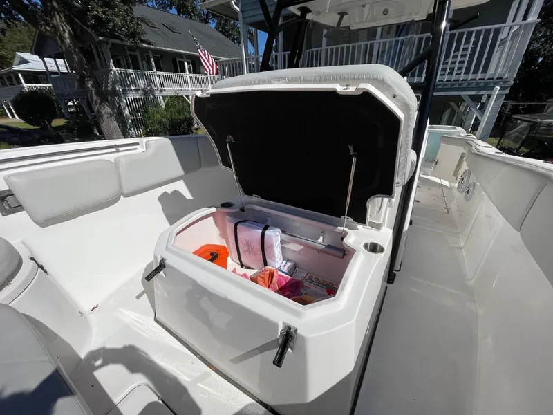 Slide: The Image of 2024 Sea Fox 288 Commander boat with open storage compartment, showcasing interior space. - 21