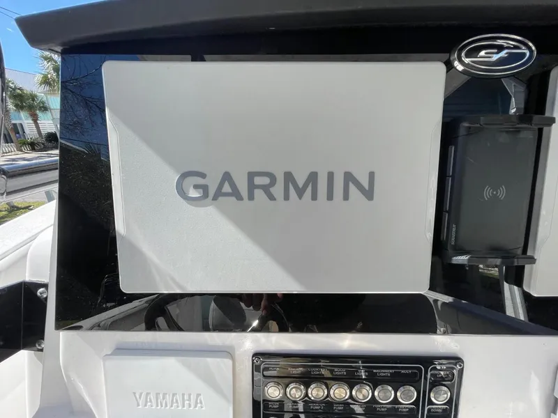 Slide: The Image of 2024 Sea Fox 288 Commander dashboard with Garmin navigation and Yamaha controls. - 24