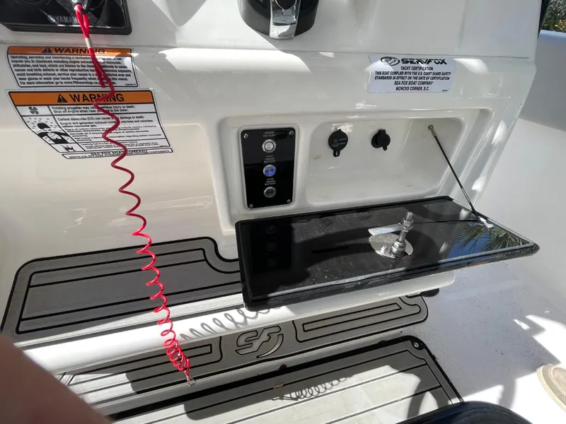 Slide: The Image of 2024 Sea Fox 288 Commander control panel with safety features and warning labels. - 28