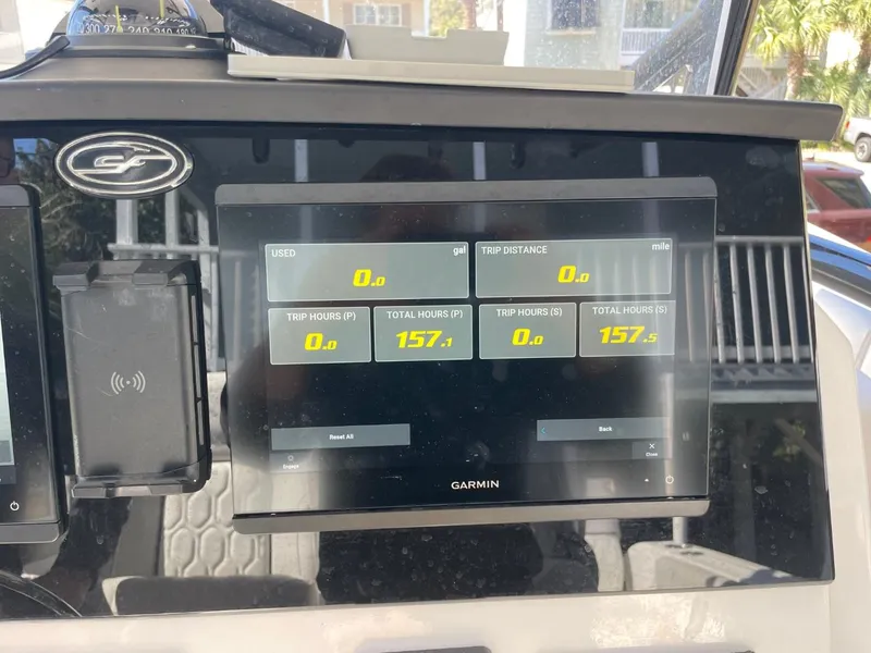 Slide: The Image of Garmin display on 2024 Sea Fox 288 Commander showing trip and total hours. - 33