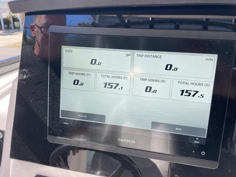 Slide: The Image of Garmin display on 2024 Sea Fox 288 Commander showing trip and total hours. - 34