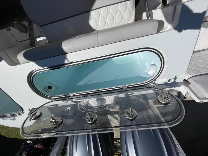 Slide: The Image of 2024 Sea Fox 288 Commander boat with open storage compartment and seating. - 42