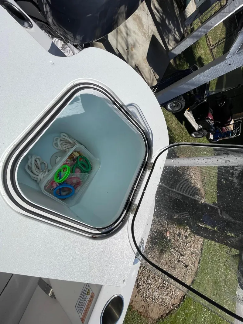 Slide: The Image of 2024 Sea Fox 288 Commander storage compartment with ropes and accessories. - 43