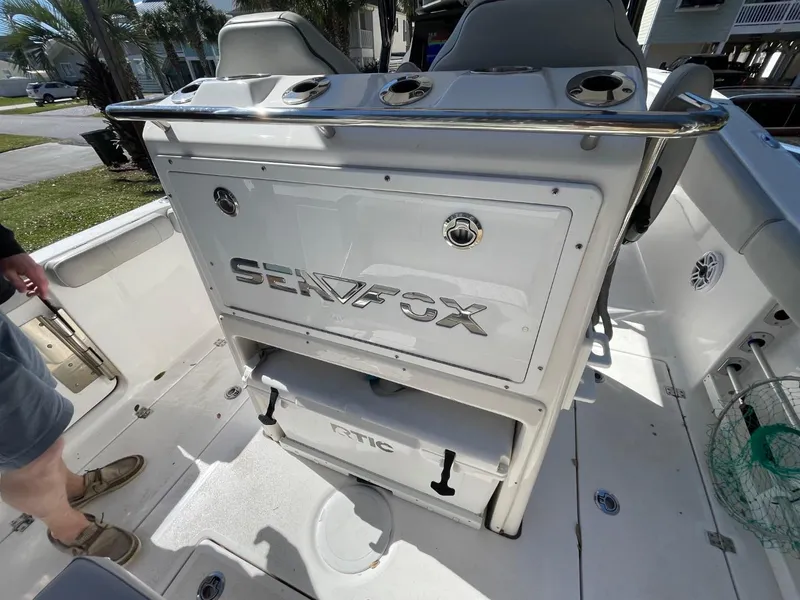 Slide: The Image of 2024 Sea Fox 288 Commander boat interior with storage and seating area. - 45