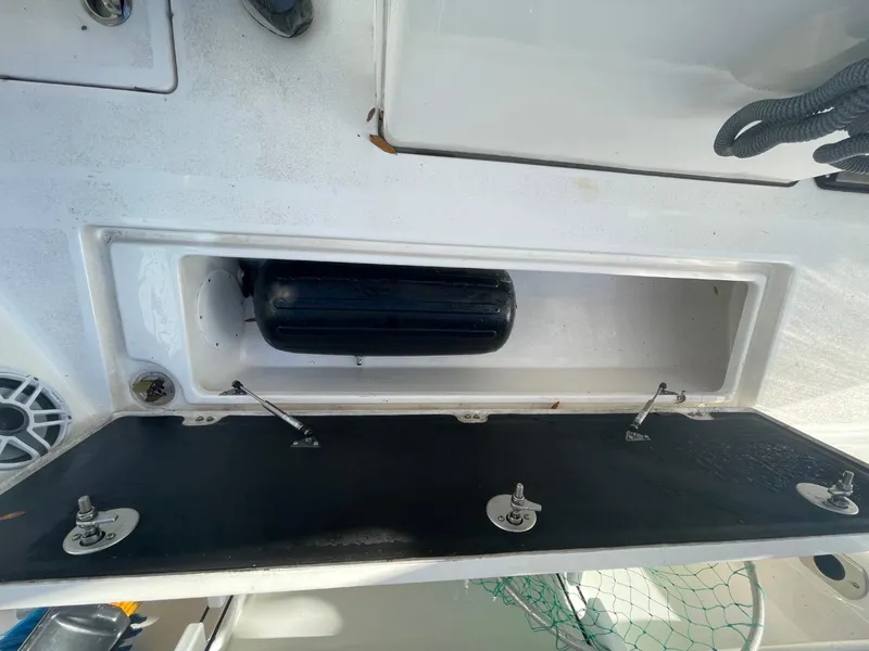Slide: The Image of Storage compartment on a 2024 Sea Fox 288 Commander boat, featuring a black fender. - 46