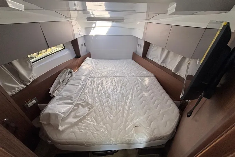 Slide: The Image of Luxurious cabin interior of 2026 Beneteau Antares 9 V2 with cozy bed and modern design. - 13