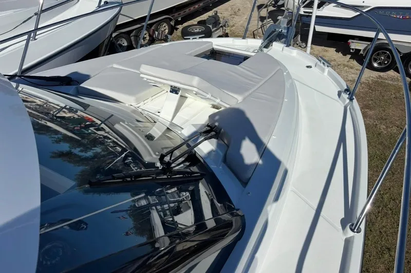 Slide: The Image of 2026 Beneteau Antares 9 V2 boat deck with seating and windshield wipers. - 17