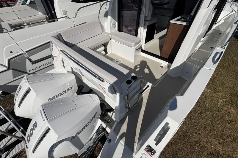 Slide: The Image of 2026 Beneteau Antares 9 V2 boat with Mercury engines, featuring spacious deck and seating area. - 3