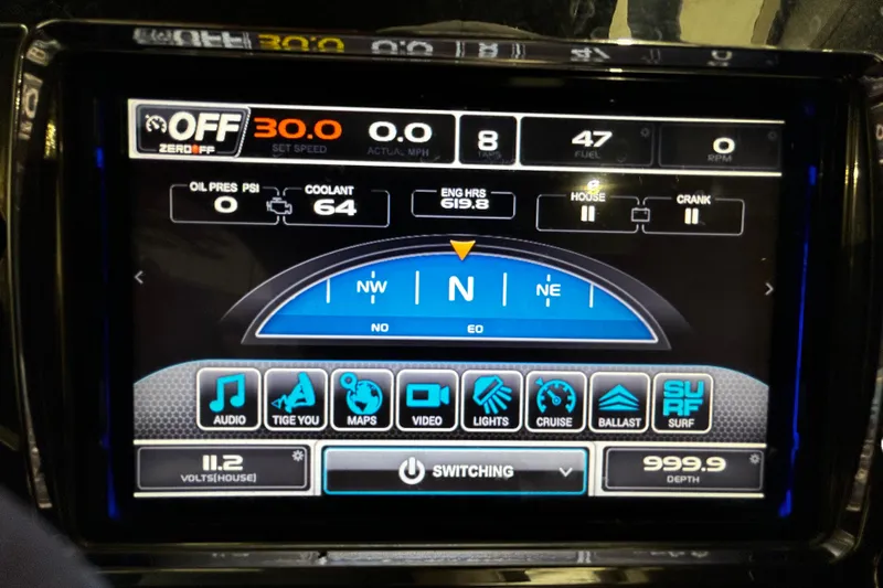 Slide: The Image of 2015 Tigé ASR dashboard display showing navigation and system controls. - 10