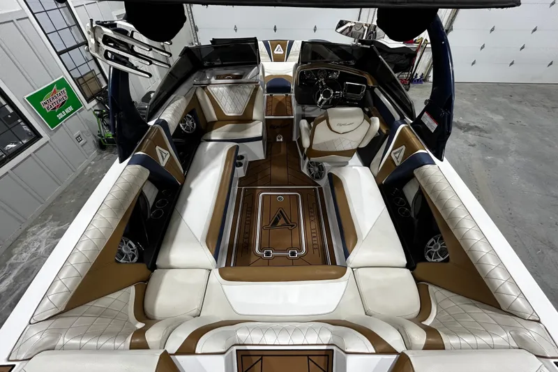 Slide: The Image of 2015 Tigé ASR boat interior with luxurious seating and modern dashboard design. - 5