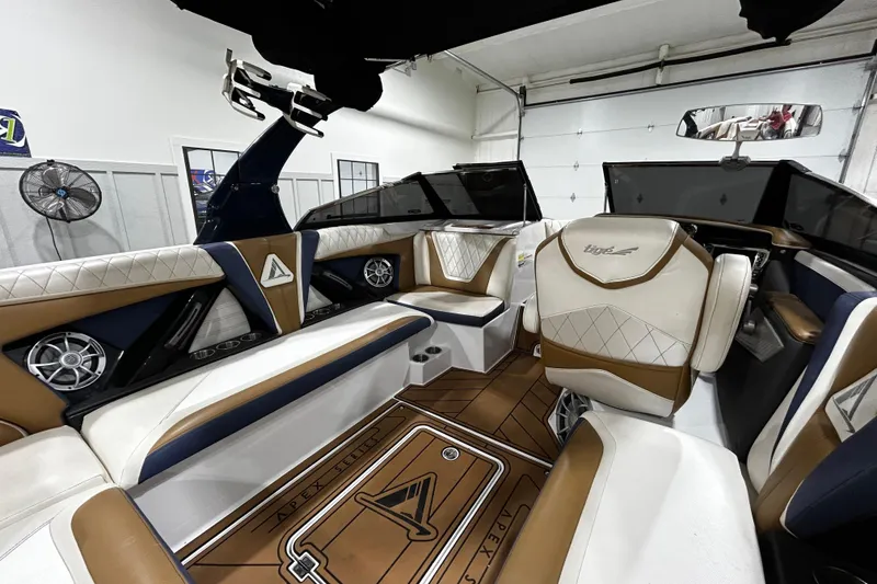 Slide: The Image of 2015 Tigé ASR boat interior with luxurious seating and modern design. - 6