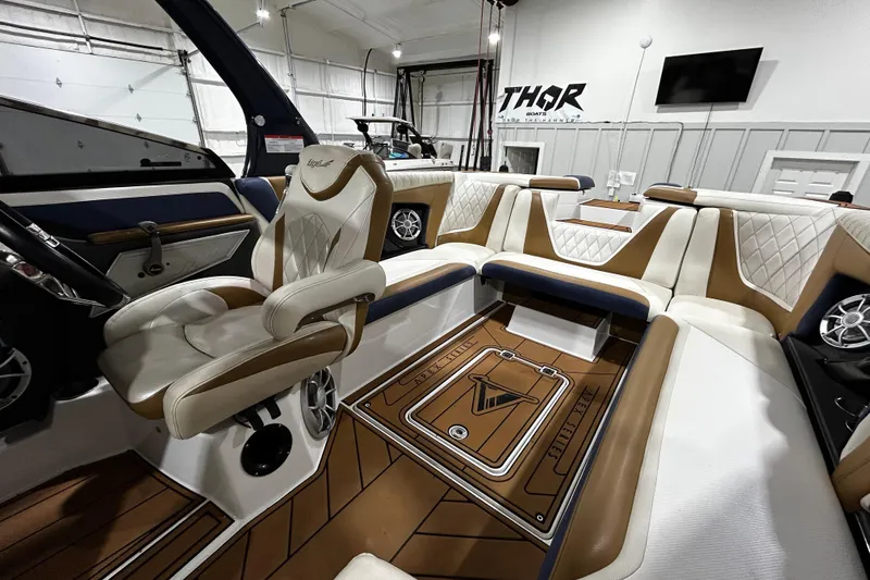Slide: The Image of Luxurious interior of 2015 Tigé ASR boat with plush seating and modern design. - 8