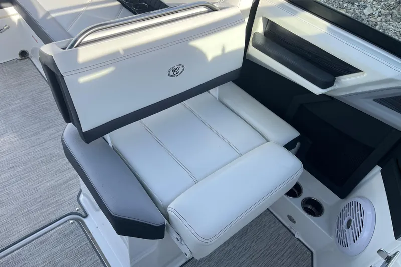Slide: The Image of 2022 Cobalt R8 boat interior with white leather seating and modern design. - 10