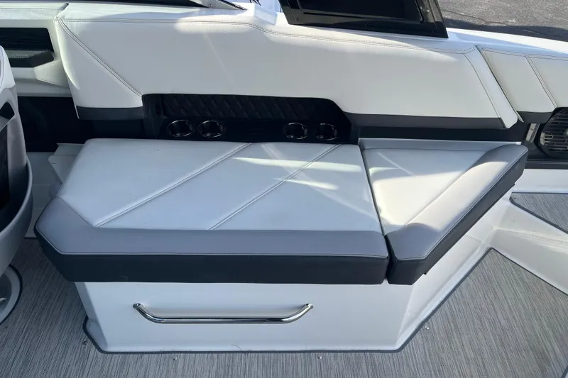 Slide: The Image of 2022 Cobalt R8 boat interior seating with cup holders and sleek design. - 12