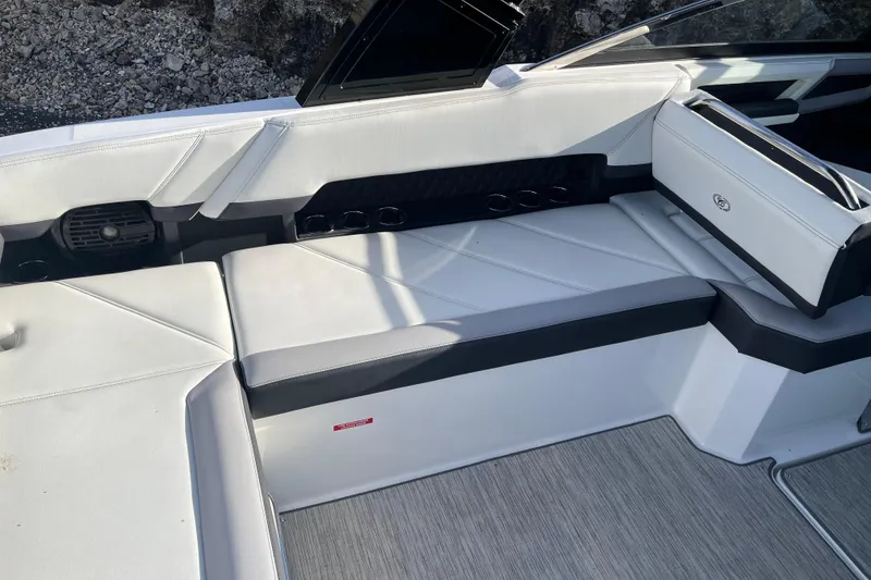 Slide: The Image of 2022 Cobalt R8 boat interior with white seating and modern design. - 15