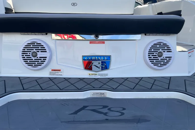 Slide: The Image of 2022 Cobalt R8 boat rear view with speakers and logo. - 16