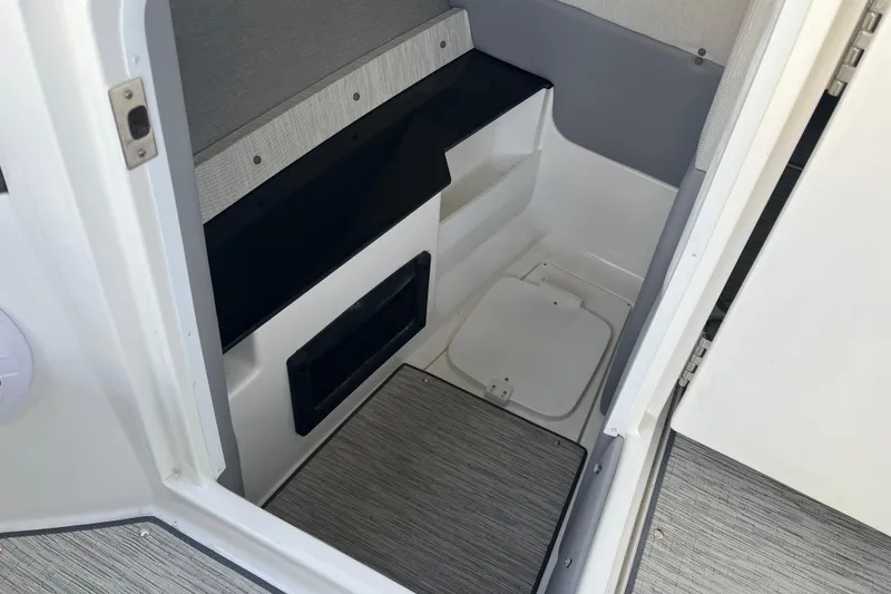 Slide: The Image of 2022 Cobalt R8 boat interior with storage compartment and sleek design. - 2