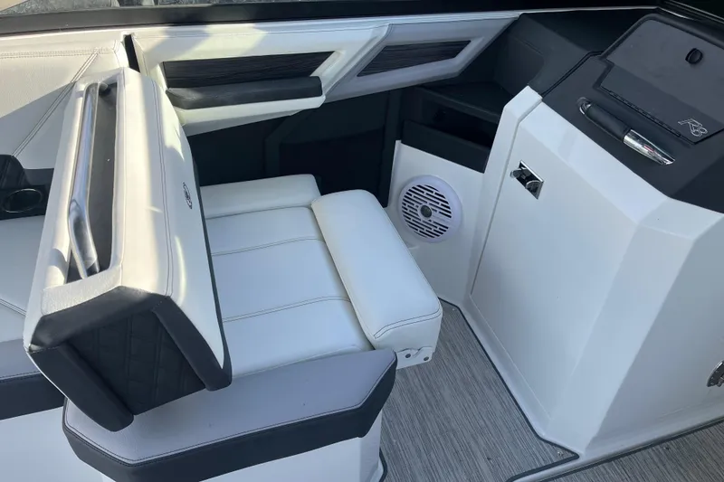Slide: The Image of 2022 Cobalt R8 boat interior with white seating and modern design elements. - 4