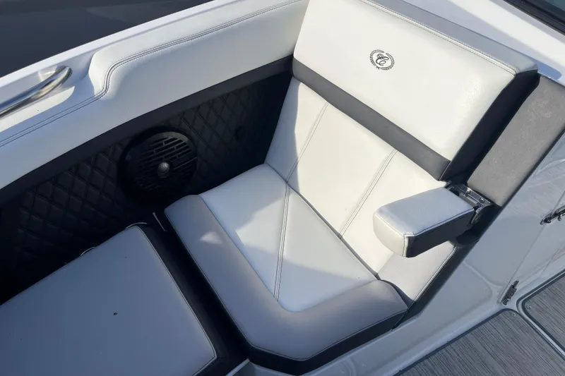 Slide: The Image of Luxurious seating in 2022 Cobalt R8 boat with white upholstery and speaker detail. - 5