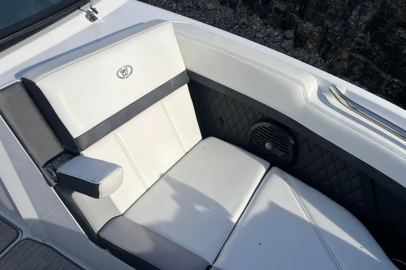 Slide: The Image of 2022 Cobalt R8 boat interior with white leather seating and speaker detail. - 7