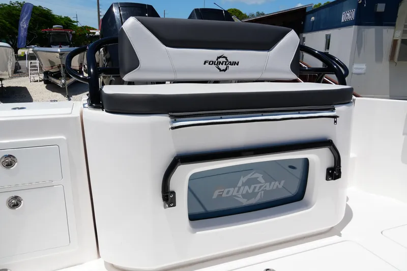 Slide: The Image of 2025 Fountain 32 NX Sportfish boat interior with branded seating and storage compartment. - 11