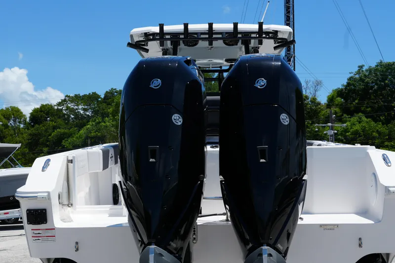 Slide: The Image of 2025 Fountain 32 NX Sportfish boat with dual outboard engines, rear view. - 4