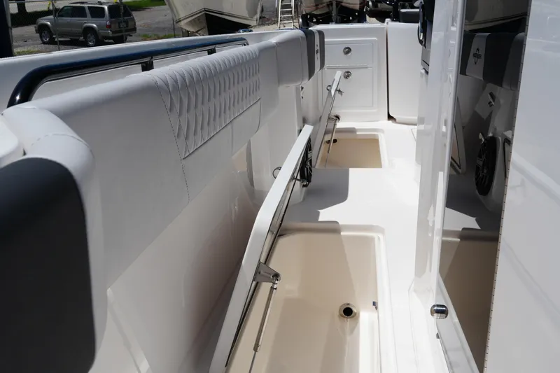 Slide: The Image of 2025 Fountain 32 NX Sportfish boat interior with storage compartments and seating. - 6