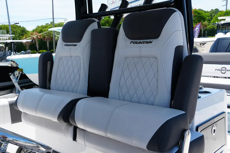 Slide: The Image of 2025 Fountain 32 NX Sportfish boat seats with diamond stitching and logo detail. - 9