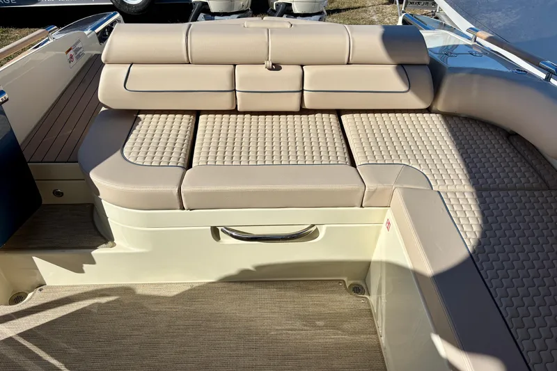Slide: The Image of 2026 Chris-Craft Launch 31 GT boat interior with beige cushioned seating. - 10