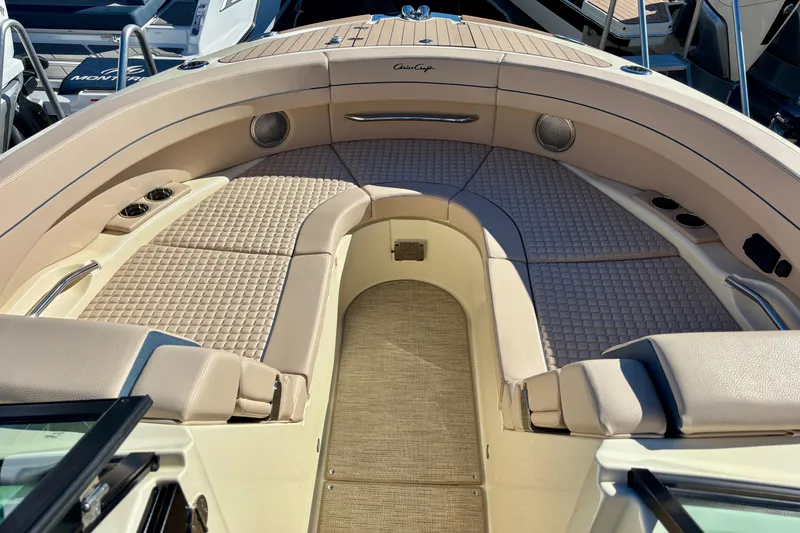 Slide: The Image of 2026 Chris-Craft Launch 31 GT dashboard with steering wheel and navigation display. - 16