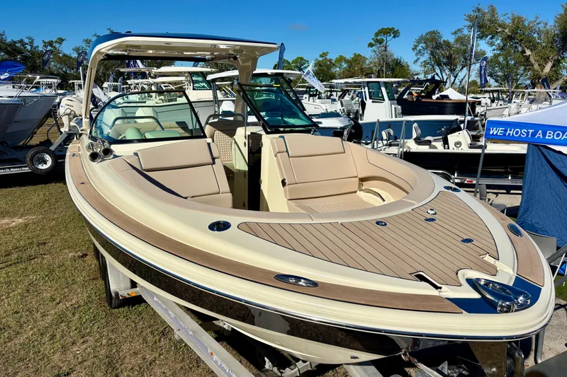 Slide: The Image of 2026 Chris-Craft Launch 31 GT steering wheel and control panel, featuring luxurious design elements. - 17