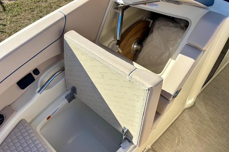 Slide: The Image of 2026 Chris-Craft Launch 31 GT boat interior with storage compartment open. - 22