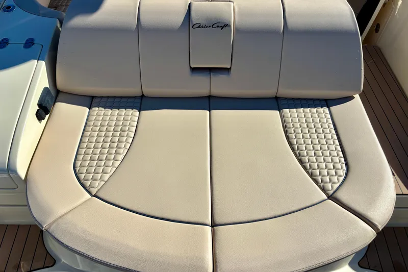 Slide: The Image of 2026 Chris-Craft Launch 31 GT boat seat with beige upholstery and quilted accents. - 6
