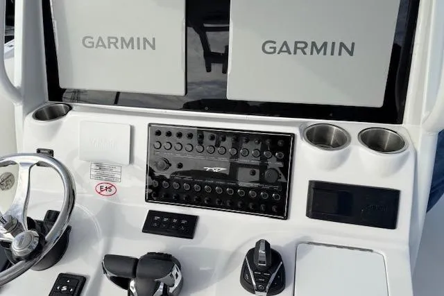 Slide: The Image of 2026 Tidewater 320 CC Adventure boat with luxurious white seating and modern design. - 11