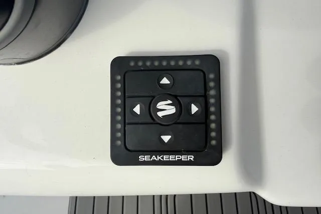 Slide: The Image of 2026 Tidewater 320 CC Adventure boat dashboard with Garmin displays and Yamaha controls. - 12