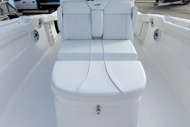 Slide: The Image of 2026 Tidewater 320 CC Adventure boat interior with open hatch and control panel. - 17