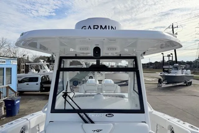 Slide: The Image of Control panel and storage area inside 2026 Tidewater 320 CC Adventure boat. - 19