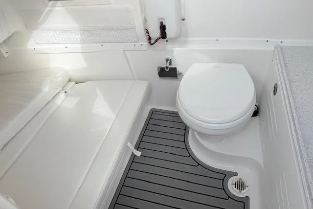 Slide: The Image of 2026 Tidewater 320 CC Adventure boat interior with Garmin equipment and sleek design. - 22