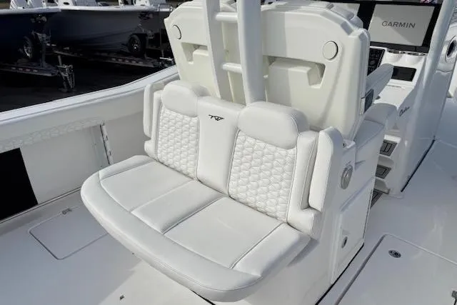 Slide: The Image of Livewell on 2026 Tidewater 320 CC Adventure boat, open lid, showing interior. - 9