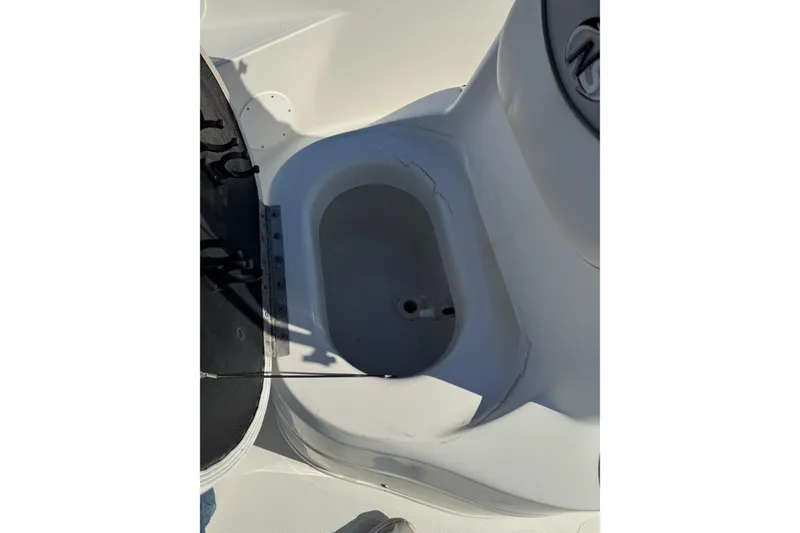 Slide: The Image of 2015 NauticStar 1910 NauticBay boat interior detail, featuring a storage compartment. - 15