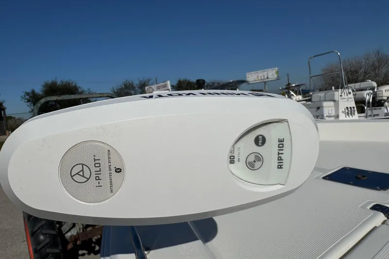 Slide: The Image of 2015 NauticStar 1910 NauticBay boat with i-Pilot Riptide GPS system, clear blue sky background. - 2
