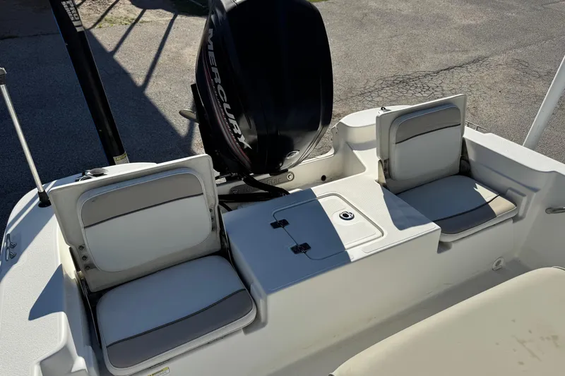 Slide: The Image of 2015 NauticStar 1910 NauticBay boat with Mercury engine and cushioned seating. - 4