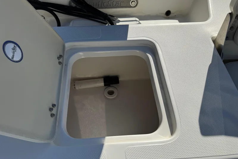 Slide: The Image of Open storage compartment on a 2015 NauticStar 1910 NauticBay boat. - 5
