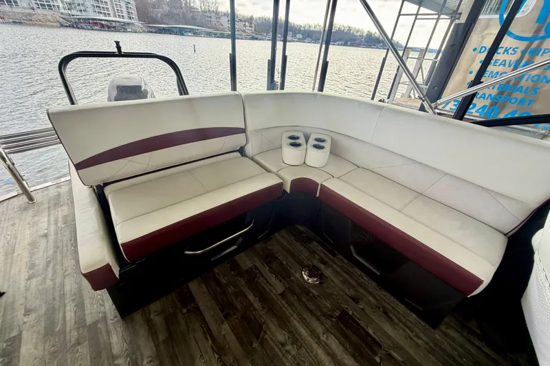 Slide: The Image of 2019 Crest Continental 250 SLS boat interior with maroon and white seating. - 12