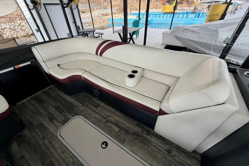 Slide: The Image of 2019 Crest Continental 250 SLS boat interior with luxurious seating and lake view. - 30