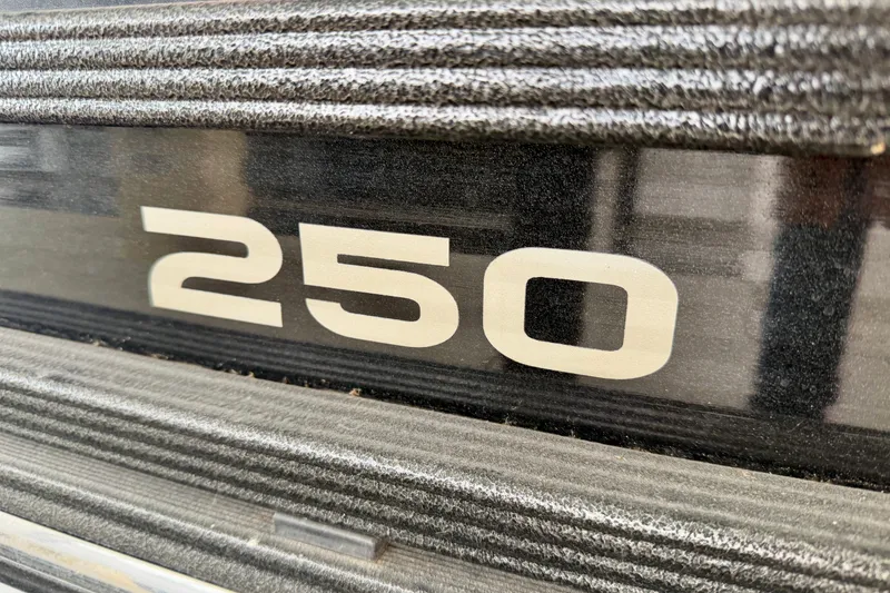 Slide: The Image of 2019 Crest Continental 250 SLS pontoon boat with Suzuki outboard motor, docked and covered. - 9