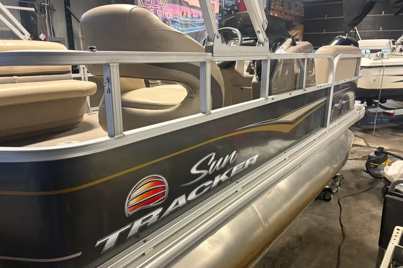 The Image of 2020 Sun Tracker Party Barge 18 DLX pontoon boat in showroom, side view. - 0