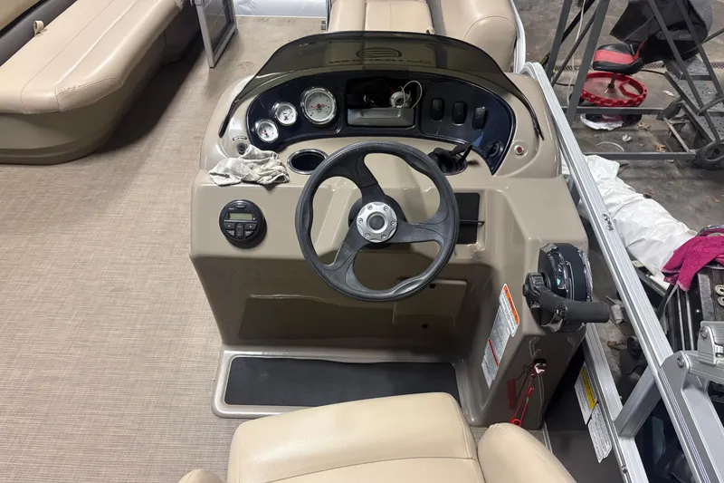 Slide: The Image of 2020 Sun Tracker Party Barge 18 DLX steering console with gauges and controls. - 5