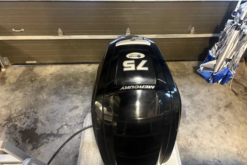 Slide: The Image of Mercury 75 HP outboard motor in garage, Sun Tracker Party Barge 18 DLX 2020. - 6