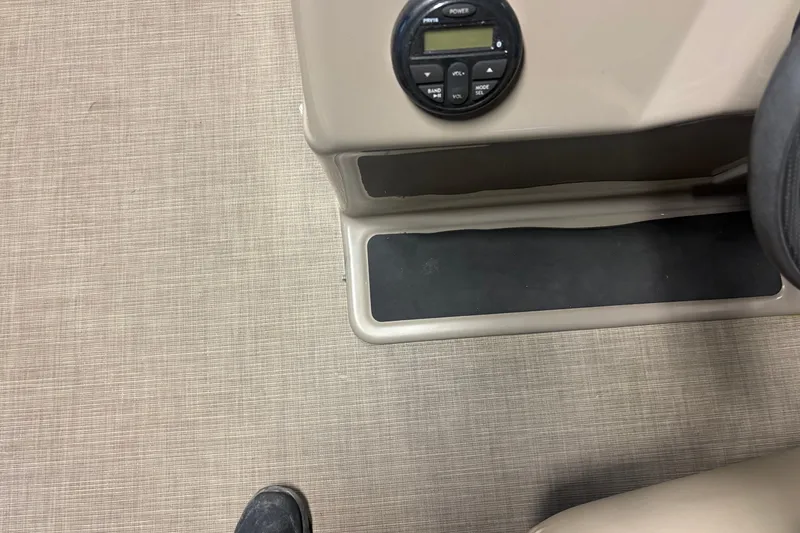 Slide: The Image of Interior view of a 2020 Sun Tracker Party Barge 18 DLX with control panel. - 8